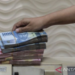 Rupiah Jumat pagi melemah jadi Rp18.074 per dolar AS